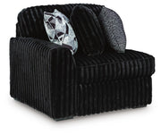 Ashley Furniture Midnight-Madness sectional with dark upholstery, angled view showing plush cushions and modern design.