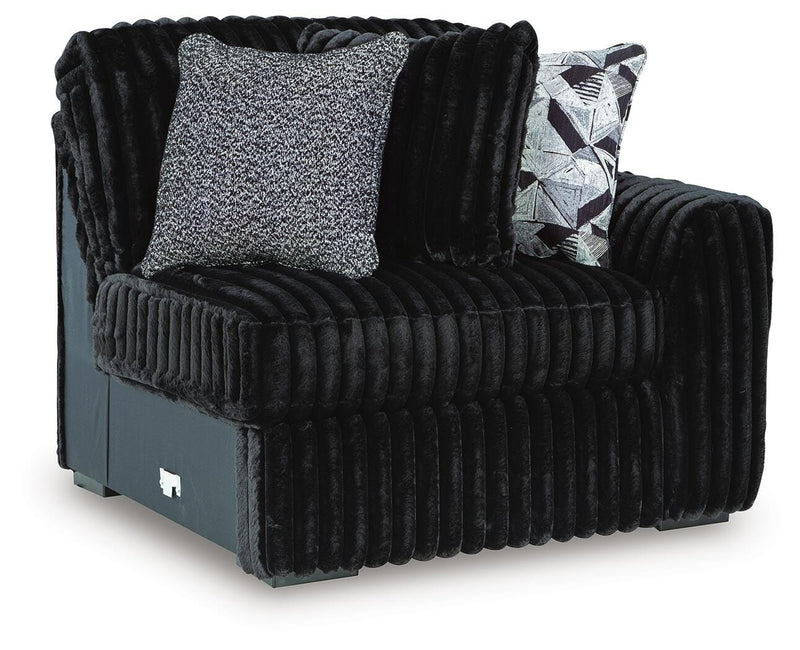 Ashley Furniture Midnight-Madness sectional sofa with plush cushions and modern design, shown from an angled side view.