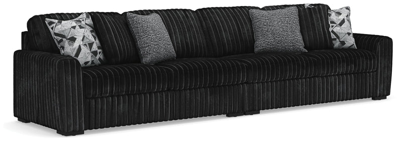 Ashley Furniture Midnight-Madness sectional sofa with plush cushions and dark fabric upholstery, shown in a spacious living room setting.