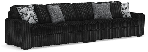 Ashley Furniture Midnight-Madness sectional sofa with plush cushions and dark fabric upholstery, shown in a spacious living room setting.