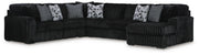 Ashley Furniture Midnight-Madness sectional with chaise, showing dark fabric upholstery and modern design in a living room setting