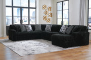 Ashley Furniture Midnight-Madness sectional with chaise, showing plush fabric, modern design, and spacious seating arrangement.