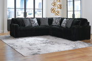 Ashley Furniture Midnight-Madness sectional with dark fabric upholstery and plush cushions, showcasing a modern living room setup.