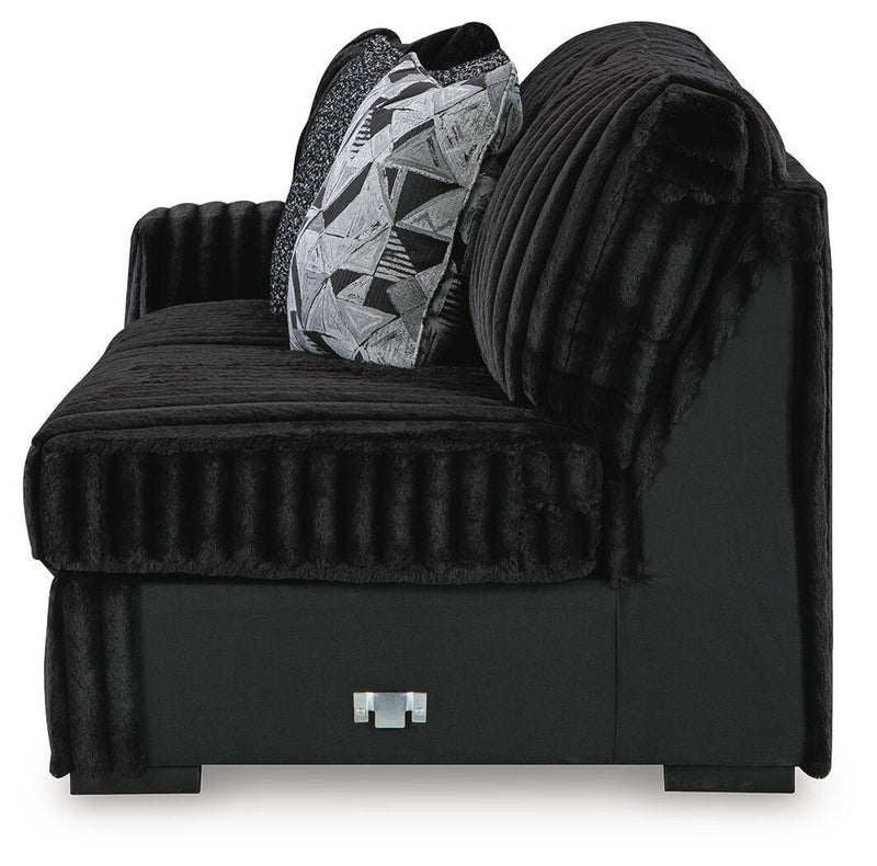 Ashley Furniture Midnight-Madness sectional with chaise, showing dark fabric upholstery and modern design in a living room setting.