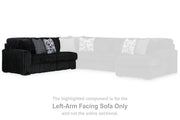 Ashley Furniture Midnight-Madness sectional with chaise, dark fabric upholstery and modern design, shown in a living room setting.