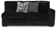 Ashley Furniture Midnight-Madness sectional sofa with plush cushions and dark upholstery, viewed head-on.