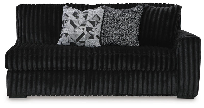 Ashley Furniture Midnight-Madness sectional with chaise, showing plush upholstery and modern design from a head-on view.