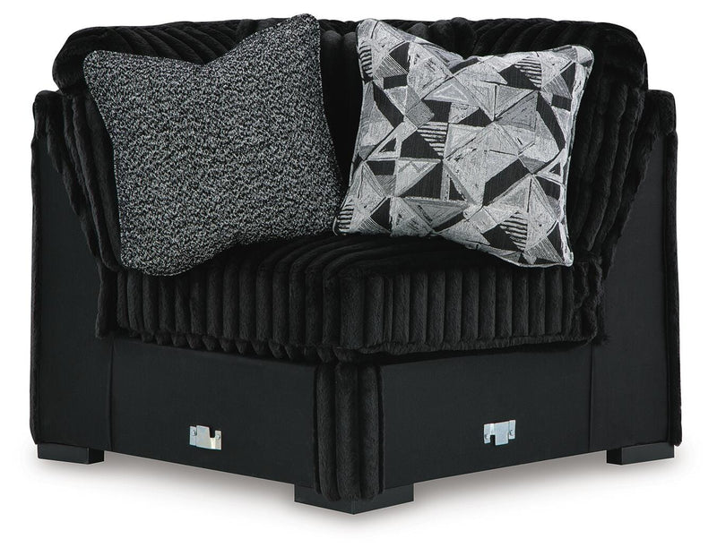 Ashley Furniture Midnight-Madness Sectional sofa with plush cushions and dark fabric, viewed from the head-on angle.