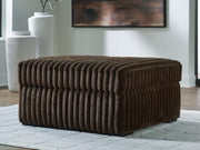 Ashley Furniture Midnight-Madness oversized accent ottoman with plush fabric and tufted top in a dark, stylish design.