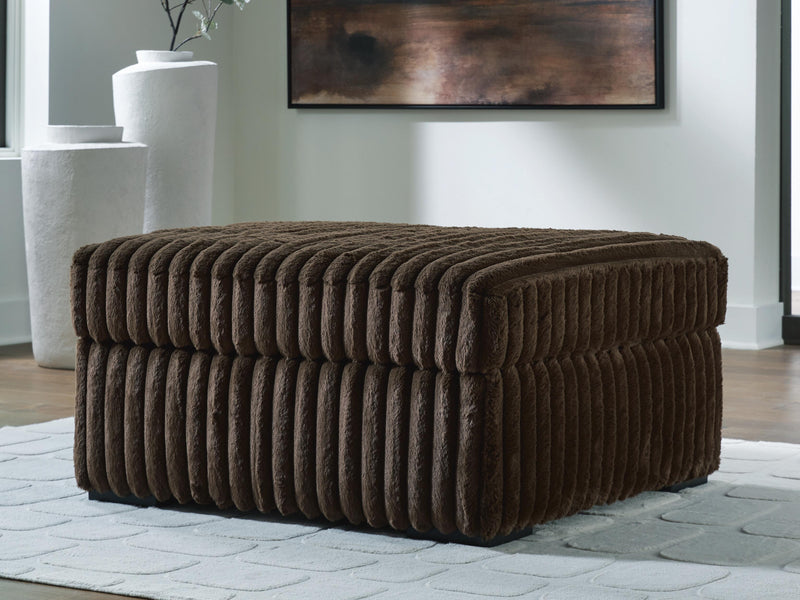 Ashley Furniture Midnight-Madness oversized accent ottoman with plush fabric and tufted top in a dark, stylish design.