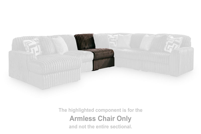 Ashley Furniture Midnight-Madness sectional in dark fabric with plush cushions and modern design, shown in a living room setting.