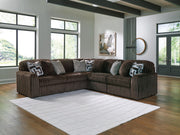 Ashley Furniture Midnight-Madness sectional sofa with plush cushions and dark fabric, shown in a modern living room setting.