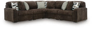 Ashley Furniture Midnight-Madness sectional with plush fabric and modern design, shown in a cozy living room setting.