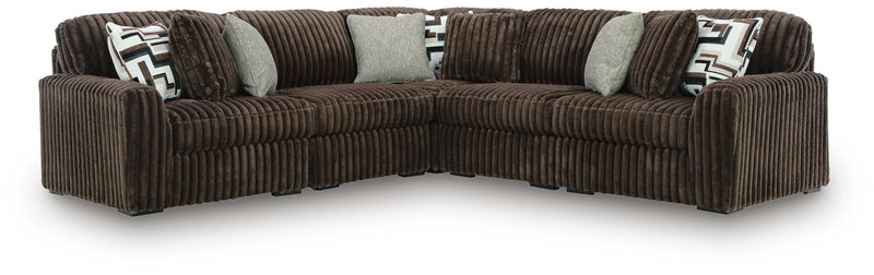 Ashley Furniture Midnight-Madness sectional with plush fabric and modern design, shown in a cozy living room setting.