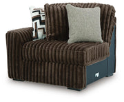 Ashley Furniture Midnight-Madness sectional sofa shown from an angled view, featuring dark fabric and plush cushions.