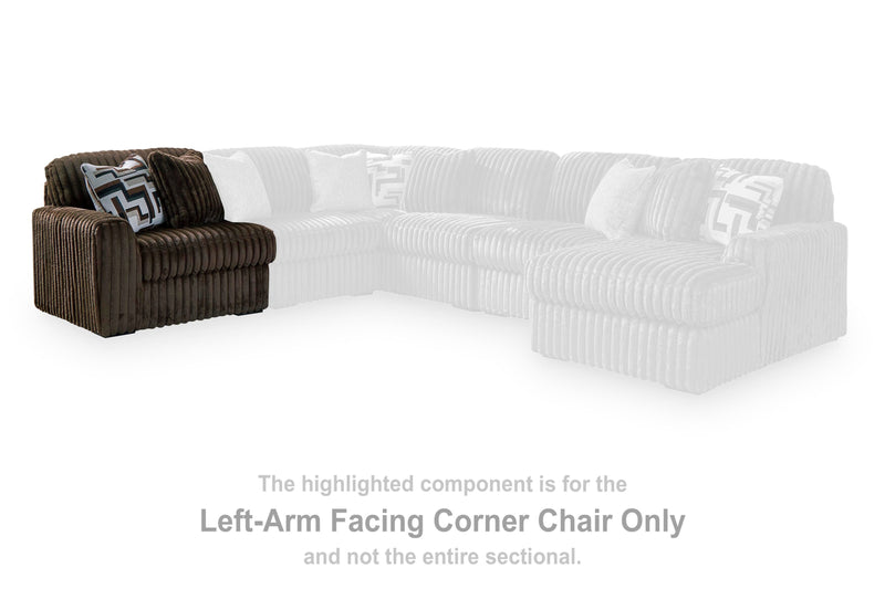 Ashley Furniture Midnight-Madness sectional sofa with plush cushions and modern design, shown in a cozy living room setting.