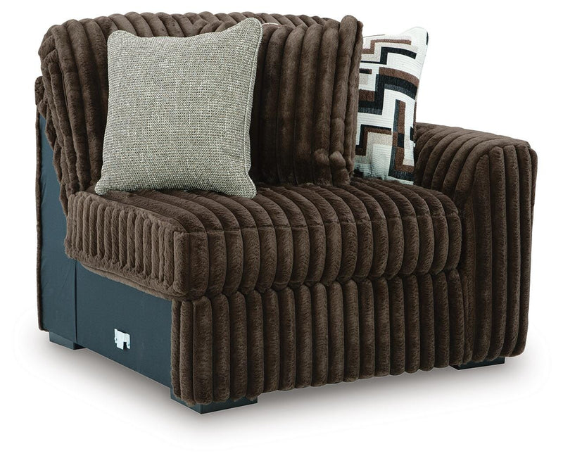 Ashley Furniture Midnight-Madness sectional sofa seen from an angled view, featuring plush cushions and modern design.