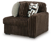 Ashley Furniture Midnight-Madness sectional sofa, angled view showing plush cushions and modern design in a cozy living room setting.