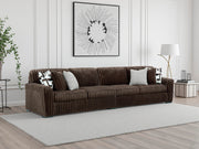 Ashley Furniture Midnight-Madness Sectional sofa with plush cushions and modern design in a stylish living room setting.