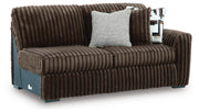 Ashley Furniture Midnight-Madness sectional sofa shown from an angled view, featuring plush cushions and modern design.