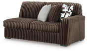Ashley Furniture Midnight-Madness sectional sofa shown from an angled view, featuring plush cushions and modern design.