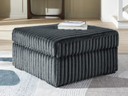 Oversized Ashley Furniture Midnight-Madness accent ottoman with plush fabric, rectangular shape, and stylish design for living room decor.