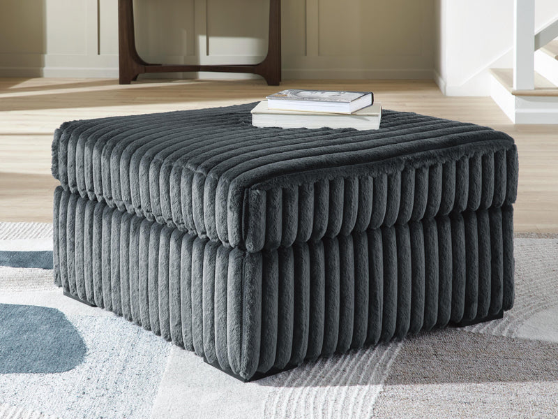 Oversized Ashley Furniture Midnight-Madness accent ottoman with plush fabric, rectangular shape, and stylish design for living room decor.
