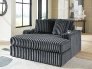 Ashley Furniture Midnight-Madness Oversized Chaise with plush fabric and wide seating for relaxing comfort.