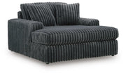 Ashley Furniture Midnight-Madness Oversized Chaise chair with plush upholstery and wide seating, shown from an angled perspective.