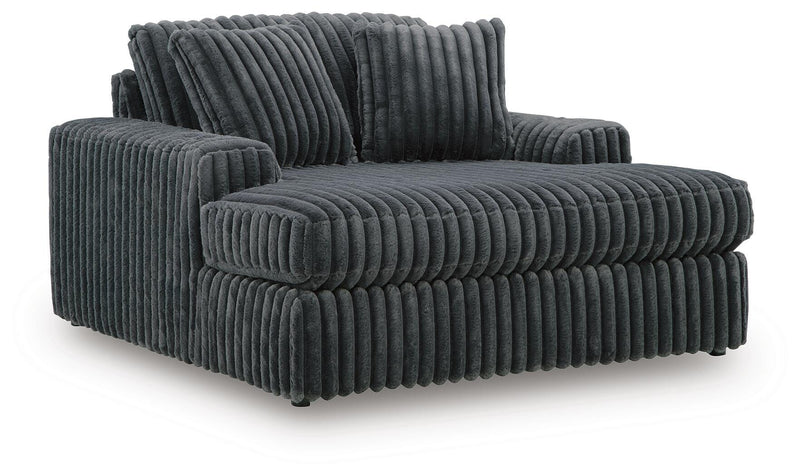 Ashley Furniture Midnight-Madness Oversized Chaise chair with plush upholstery and wide seating, shown from an angled perspective.