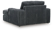 Ashley Furniture Midnight-Madness oversized chaise chair with plush upholstery and a modern design, shown from the back.