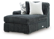 Ashley Furniture Midnight-Madness sectional with chaise, showing a modern L-shaped sofa in dark fabric with plush cushions.