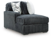 Ashley Furniture Midnight-Madness sectional with chaise, featuring dark upholstery and modern design, shown in an angled view.