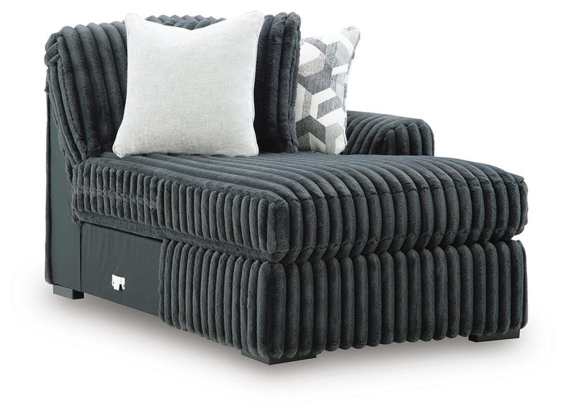 Ashley Furniture Midnight-Madness sectional with chaise, showcasing plush fabric and modern design from an angled view.