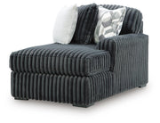 Ashley Furniture Midnight-Madness sectional with chaise, showing dark fabric upholstery and contemporary design from an angled view.