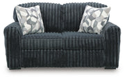 Ashley Furniture Midnight-Madness Loveseat with plush fabric and cushioned armrests, shown from a head-on angle.