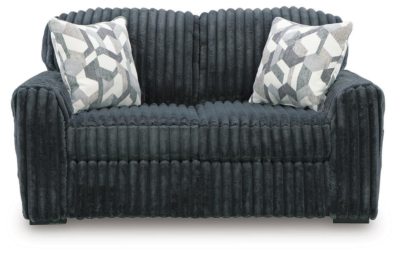 Ashley Furniture Midnight-Madness Loveseat with plush fabric and cushioned armrests, shown from a head-on angle.