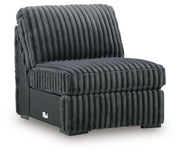 Ashley Furniture Midnight-Madness sectional sofa shown from an angled view, featuring plush cushions and modern design.