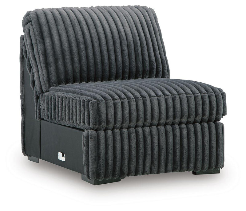 Ashley Furniture Midnight-Madness sectional sofa shown from an angled view, featuring plush cushions and modern design.