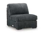 Ashley Furniture Midnight-Madness sectional sofa with plush cushions and modern design, shown from an angled side view.