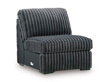 Ashley Furniture Midnight-Madness sectional sofa with plush cushions and modern design, shown from an angled side view.