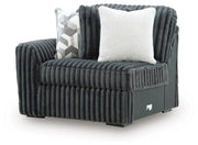 Ashley Furniture Midnight-Madness sectional sofa shown from an angled view with plush cushions and modern design.