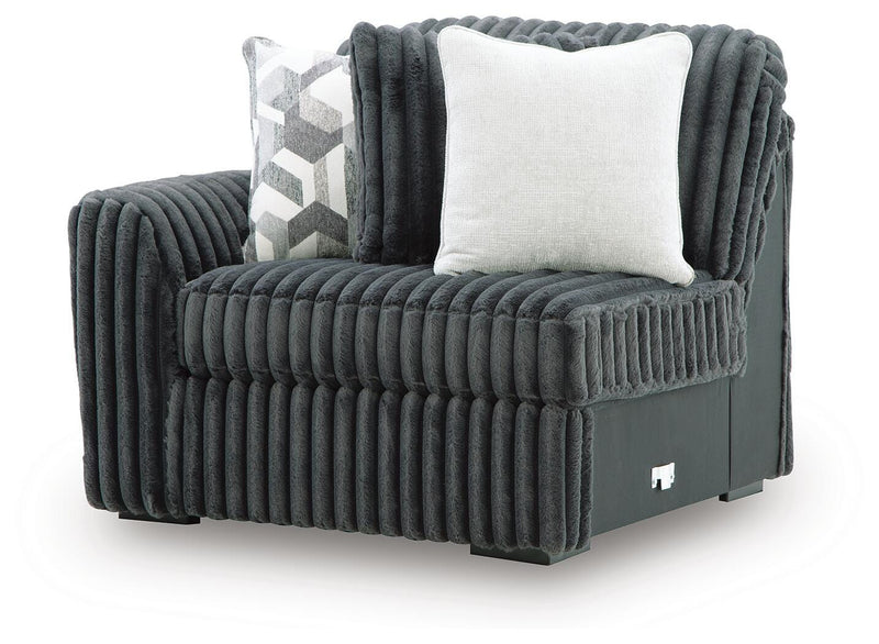 Ashley Furniture Midnight-Madness Sectional Sofa shown from an angled view with plush cushions and modern design.