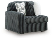 Ashley Furniture Midnight-Madness sectional sofa shown from an angle, featuring plush cushions and modern design.