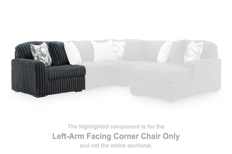 Ashley Furniture Midnight-Madness sectional sofa with dark fabric, cushioned seats, and modern design displayed in a stylish living room setting.