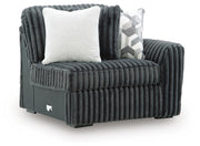 Ashley Furniture Midnight-Madness sectional sofa shown from an angled view, featuring plush cushions and modern sectional design.