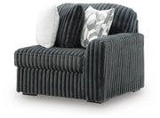 Ashley Furniture Midnight-Madness sectional sofa shown from an angled view, featuring plush cushions and modern design.