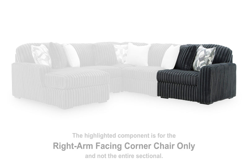 Ashley Furniture Midnight-Madness sectional sofa with plush cushions and modern design, shown in a stylish living room setting.
