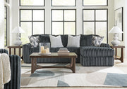 Ashley Furniture Korestone living room table set with two modern occasional tables featuring sleek wooden tops and metal legs.