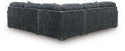 Ashley Furniture Midnight-Madness sectional sofa with plush dark upholstery, shown from the back view with detailed cushions and armrests.